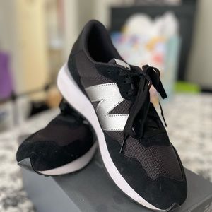 Women’s size 11 1/2 New Balance WS237CC running course shoes. Black with silver.